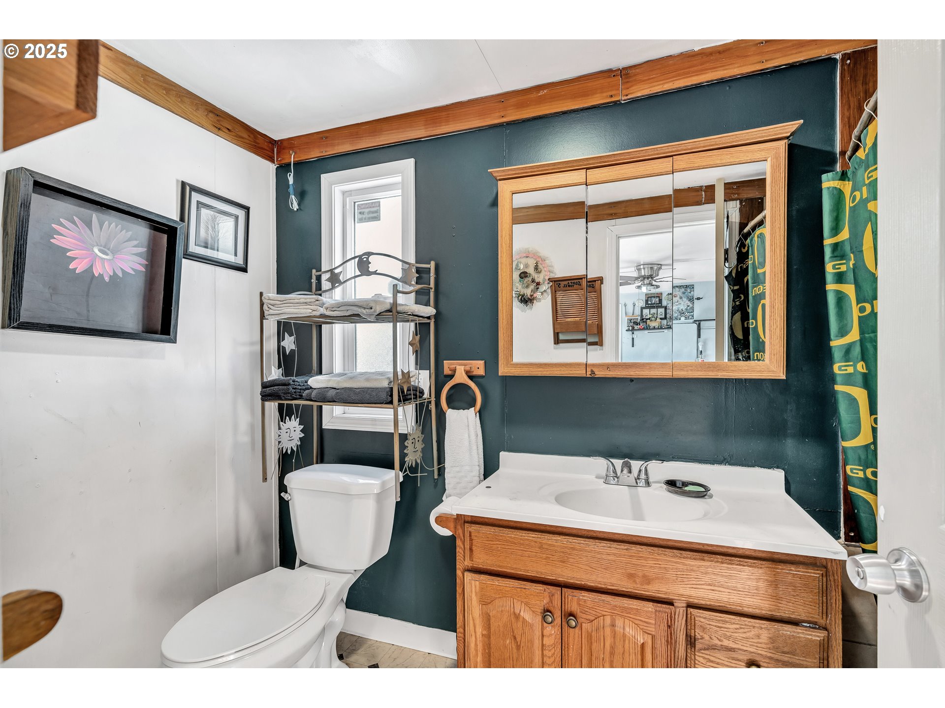 5885 Northeast Jacobson Street, Unit 70 Hillsboro, OR 97124 - Photo 20 of 29 a bathroom with a toilet a sink and a mirror