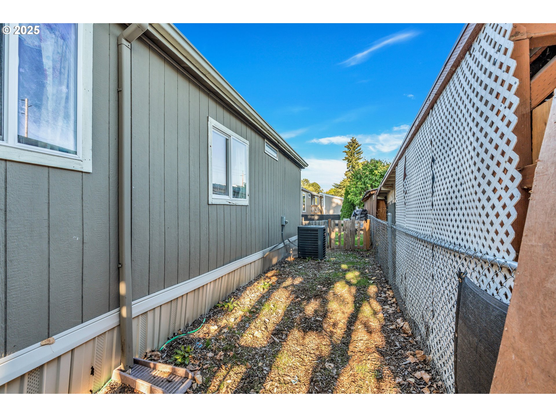 5885 Northeast Jacobson Street, Unit 70 Hillsboro, OR 97124 - Photo 22 of 29 a backyard of a house with table and chairs
