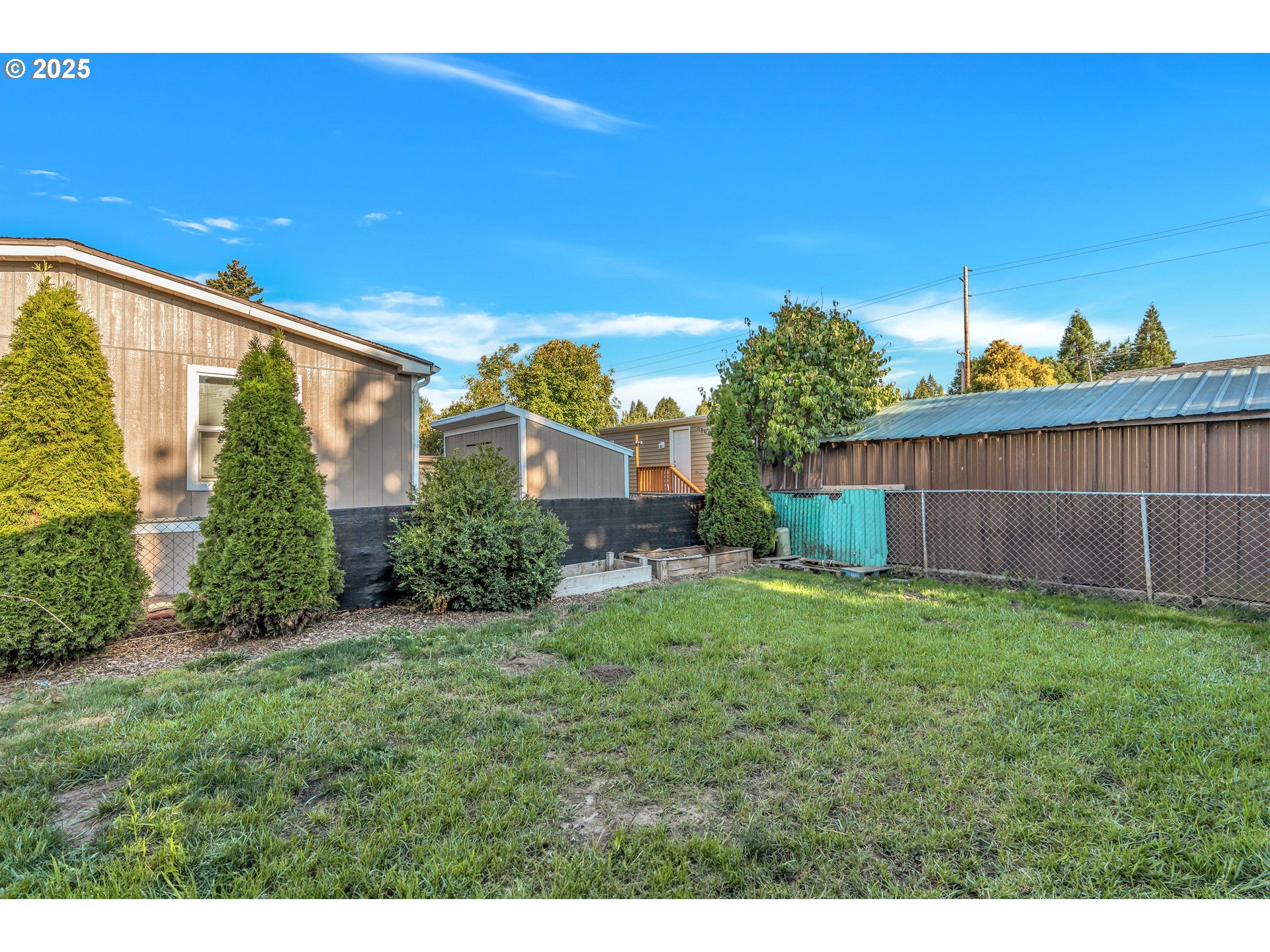 5885 Northeast Jacobson Street, Unit 70 Hillsboro, OR 97124 - Photo 24 of 29 a view of a backyard with plants