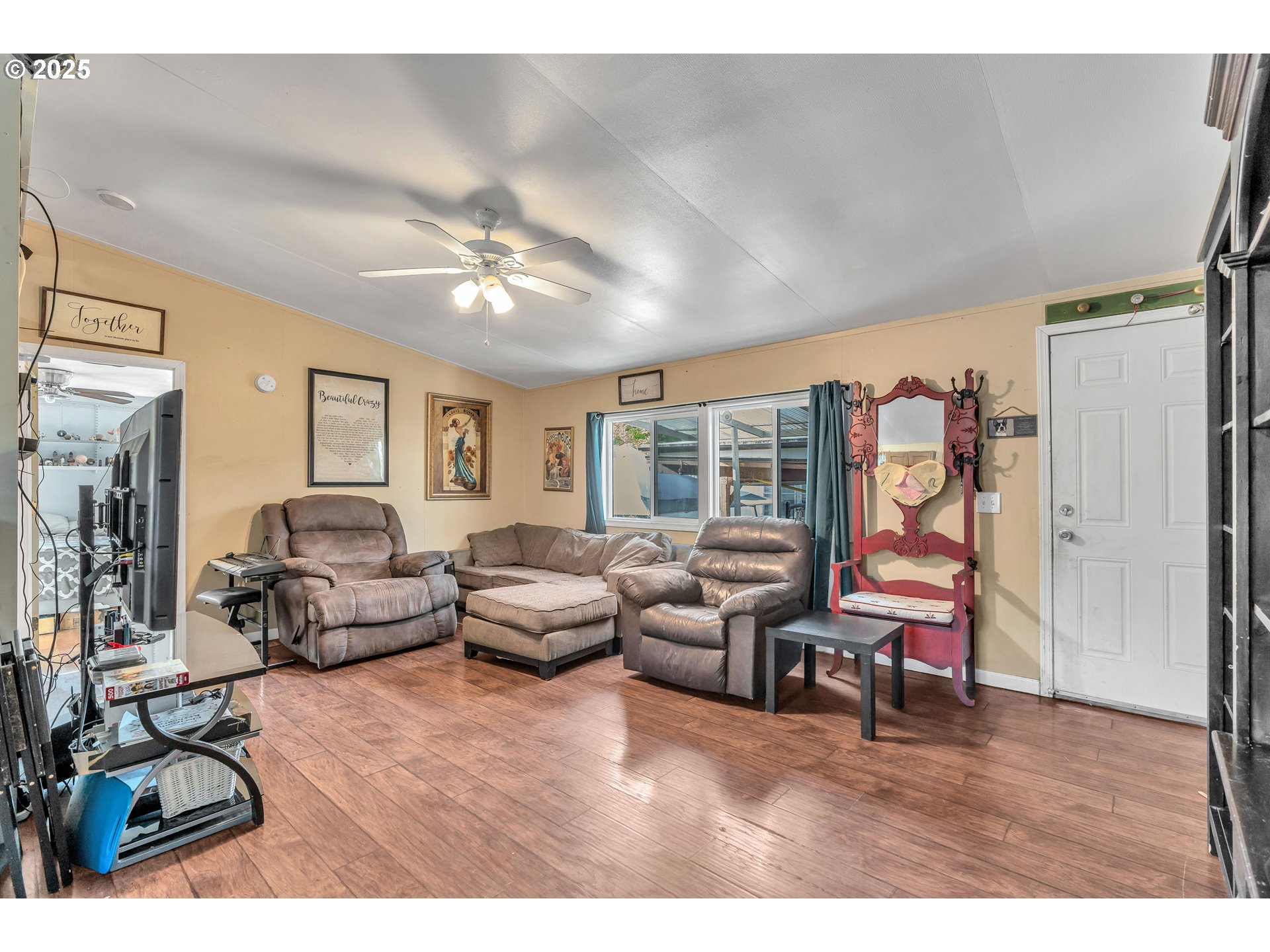 5885 Northeast Jacobson Street, Unit 70 Hillsboro, OR 97124 - Photo 6 of 29 a living room with furniture and a large window