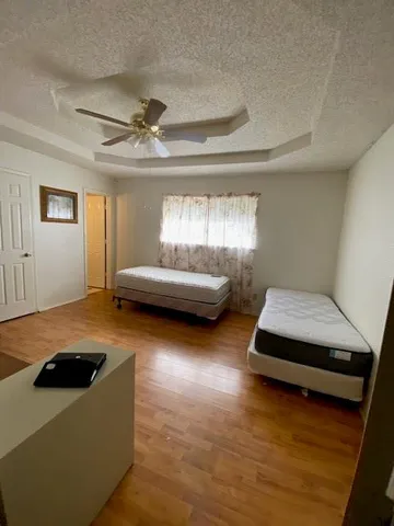 a living room with furniture and a pool table