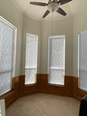a room with window and a chandelier