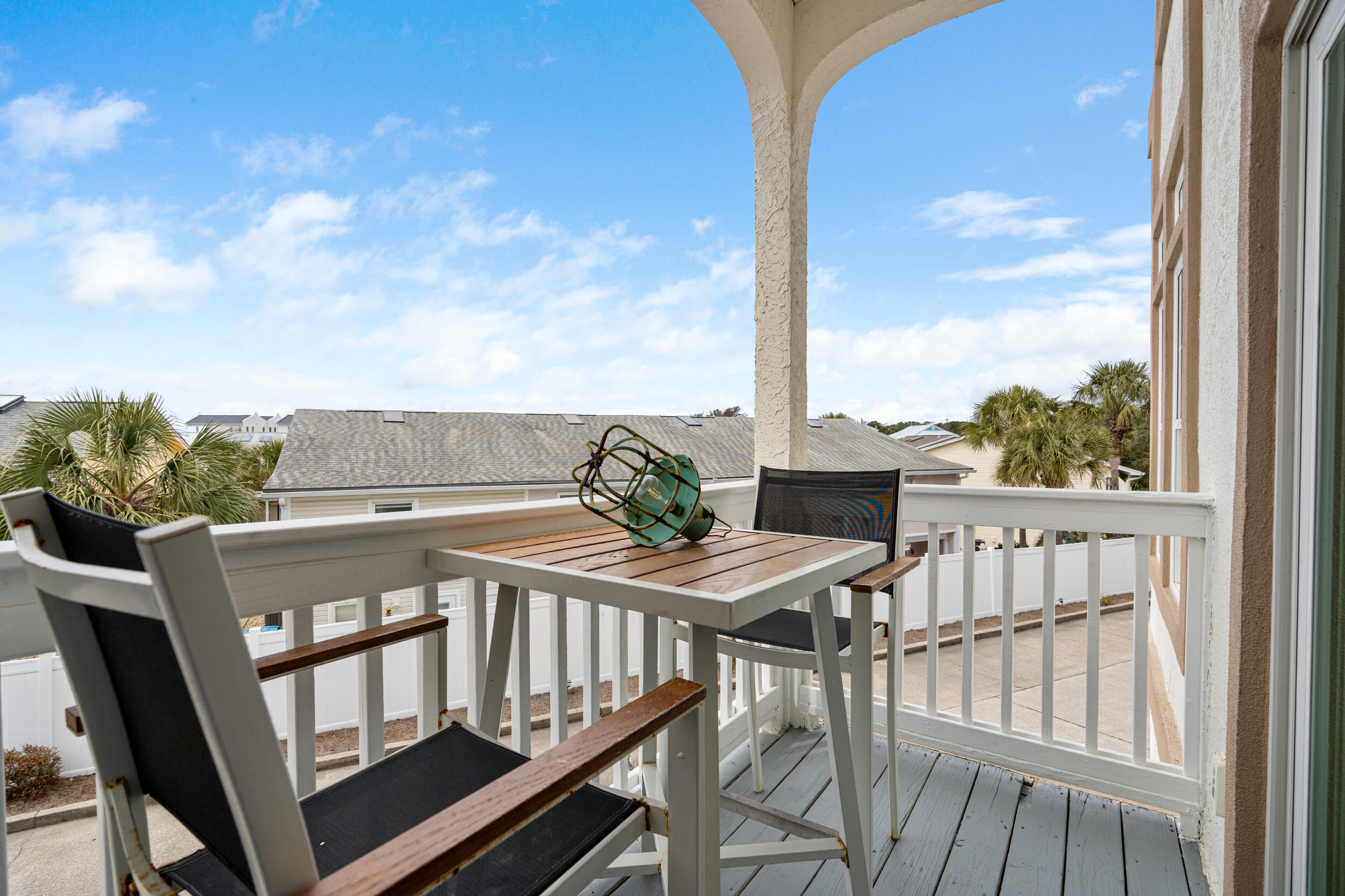 17878 Front Beach Road, Unit E2 Panama City Beach, FL 32413 - Photo 10 of 34 a view of a balcony with furniture