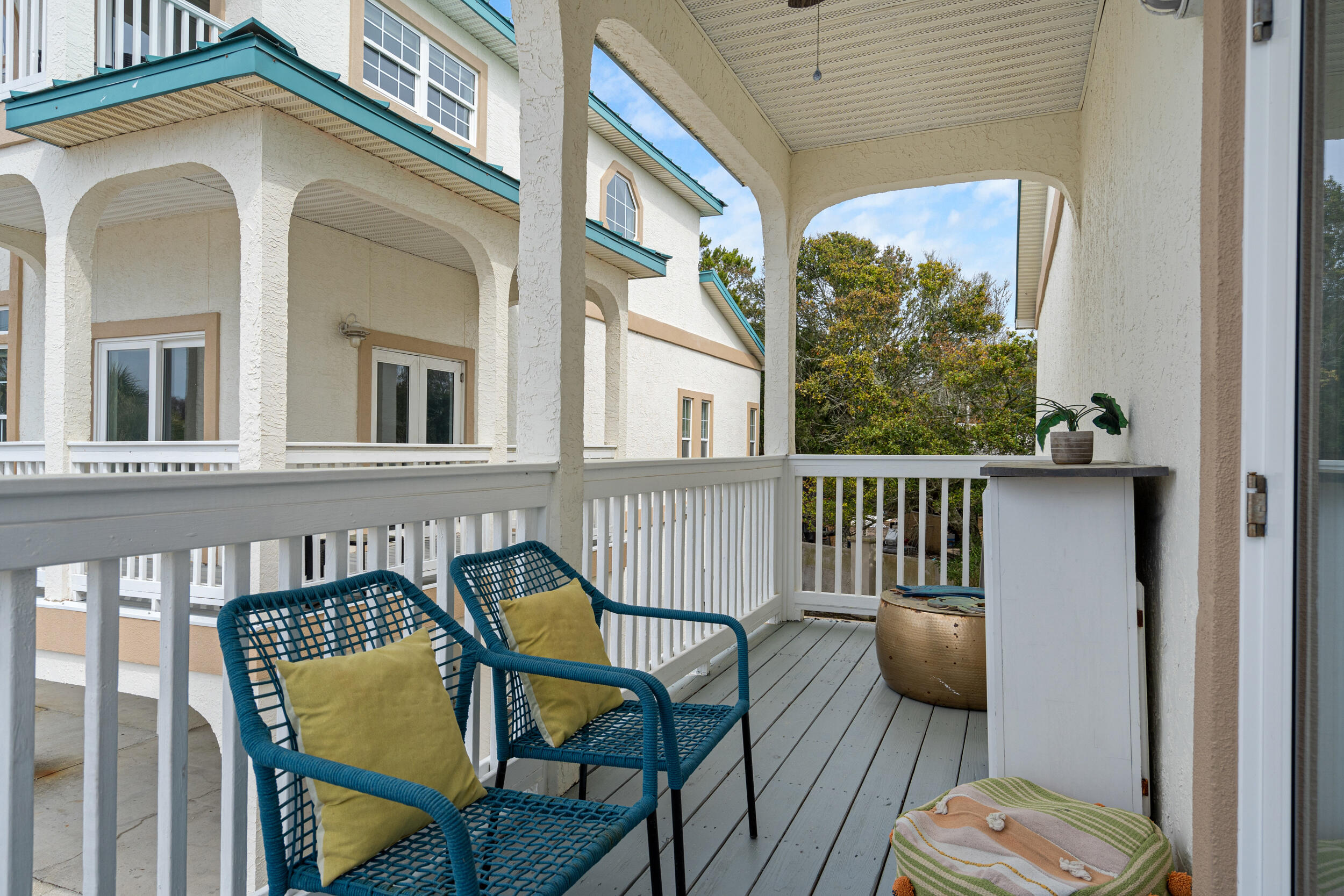 17878 Front Beach Road, Unit E2 Panama City Beach, FL 32413 - Photo 11 of 34 a view of a balcony with two chairs and a table