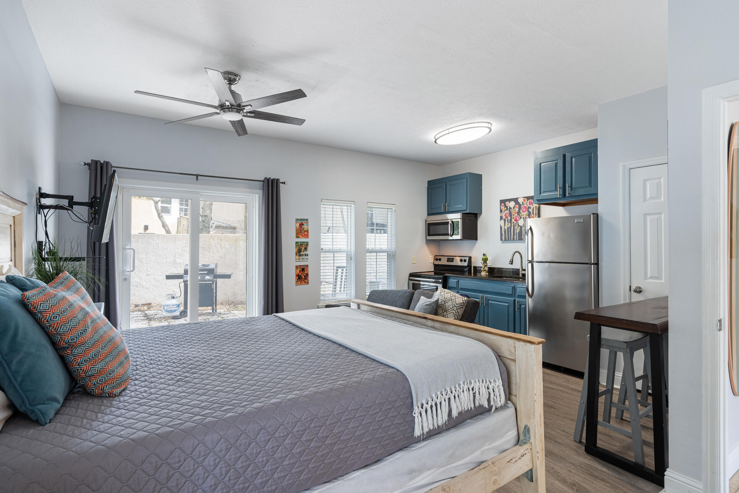 17878 Front Beach Road, Unit E2 Panama City Beach, FL 32413 - Photo 28 of 34 a bedroom with a large bed and a chandelier