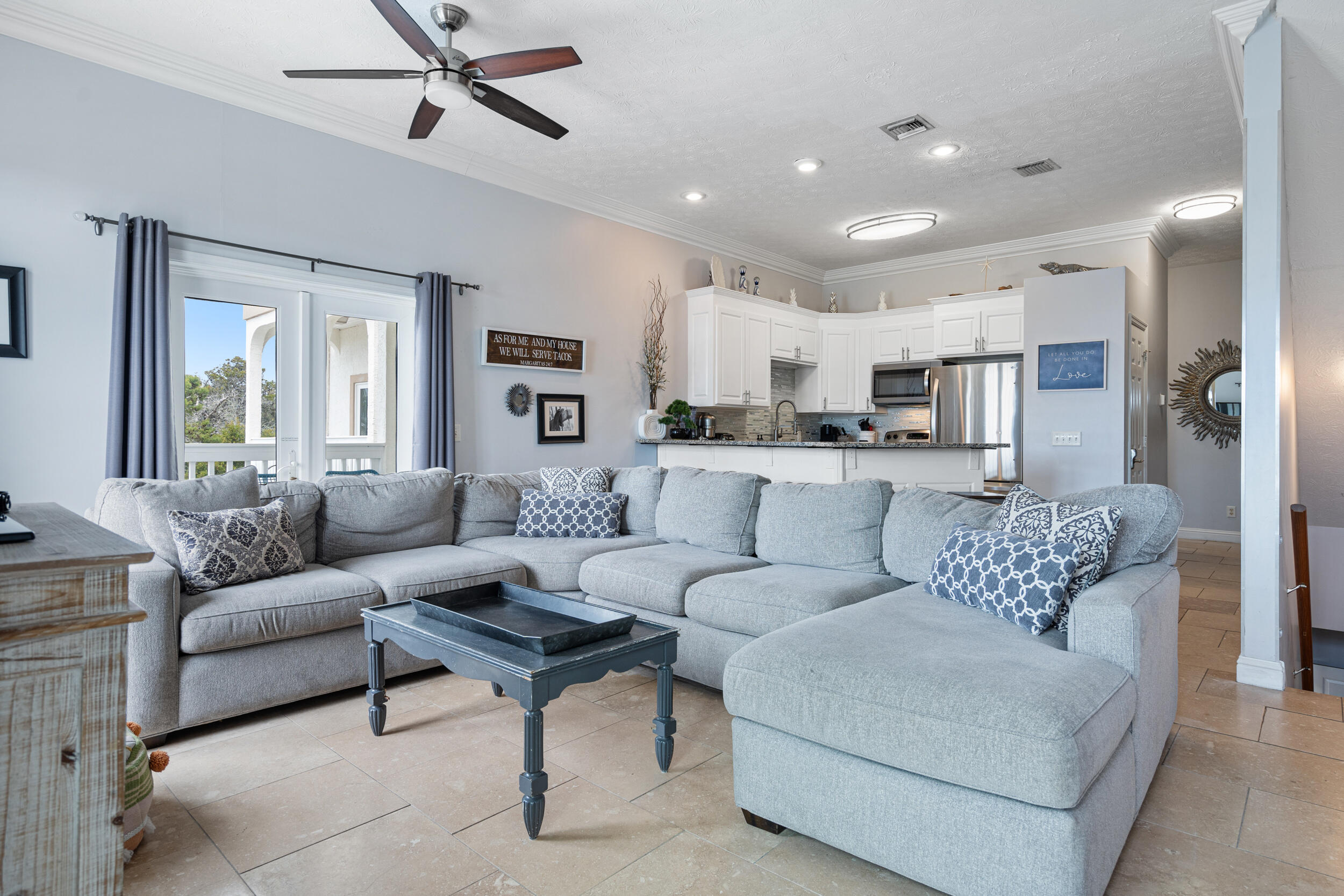 17878 Front Beach Road, Unit E2 Panama City Beach, FL 32413 - Photo 5 of 34 a living room with furniture and a view of kitchen