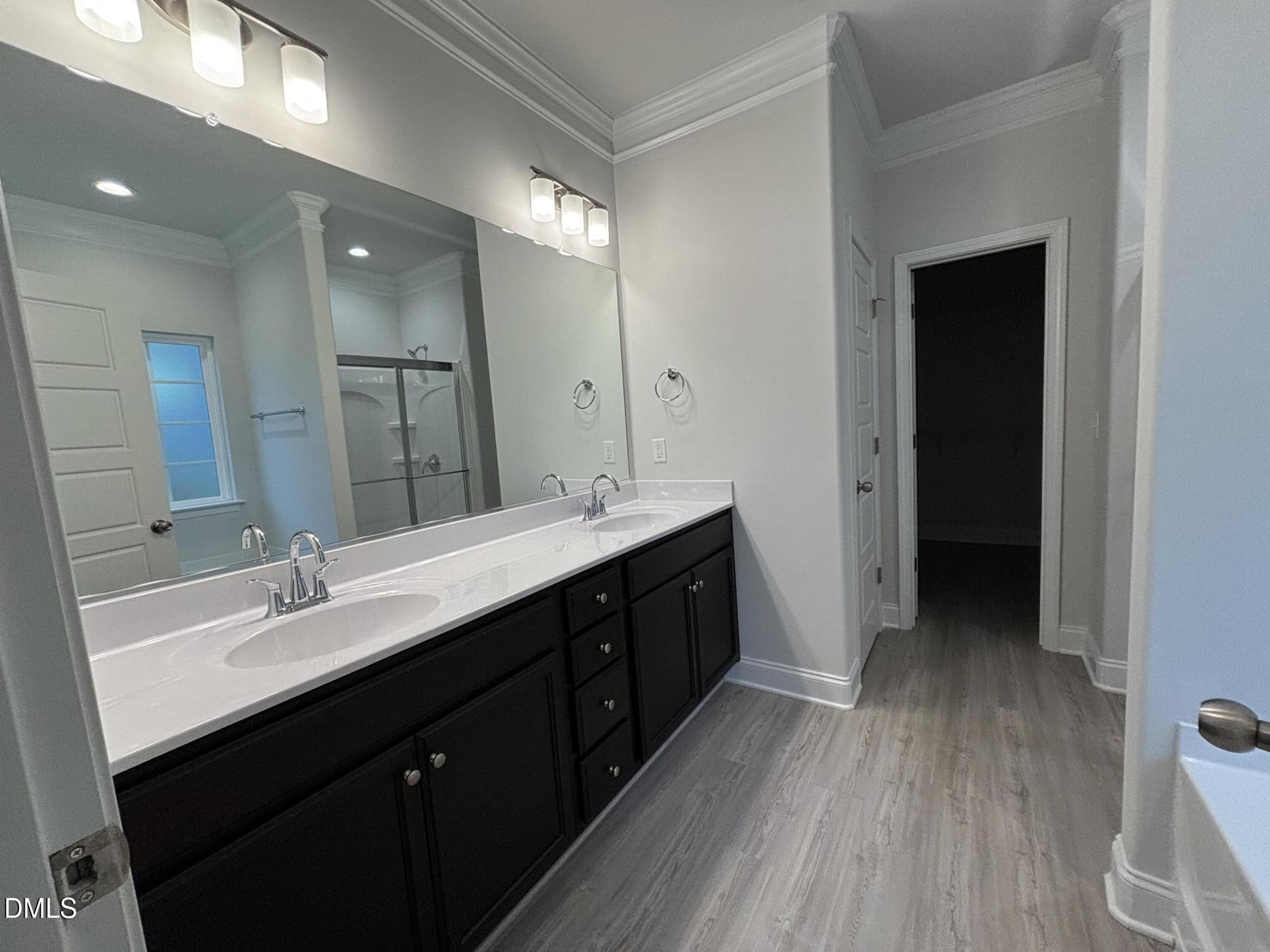 1911 Darrell Drive, Unit 4 Graham, NC 27253 - Photo 11 of 14 a bathroom with a double vanity sink and a mirror