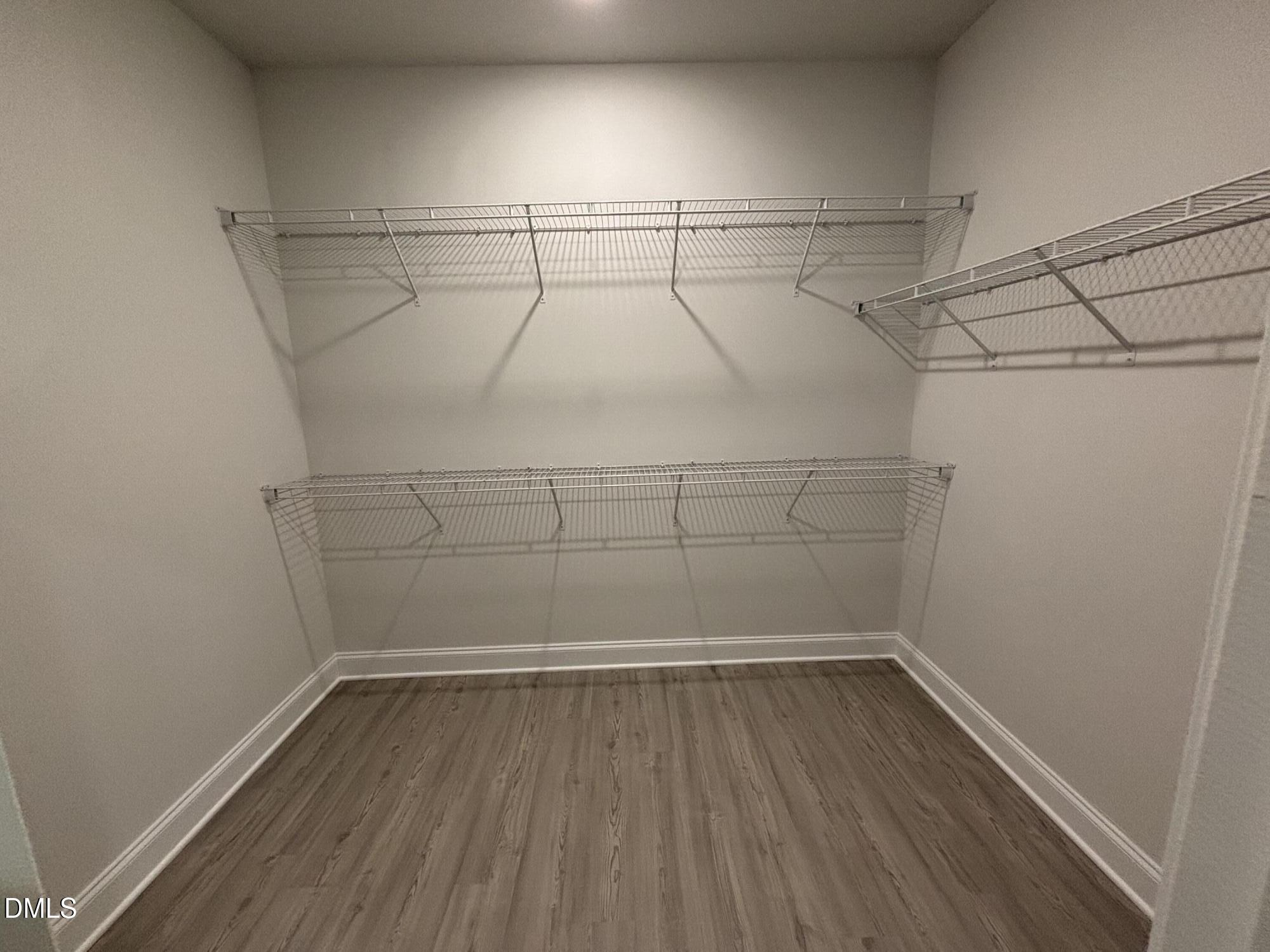 1911 Darrell Drive, Unit 4 Graham, NC 27253 - Photo 13 of 14 a view of a room with racks on the wall