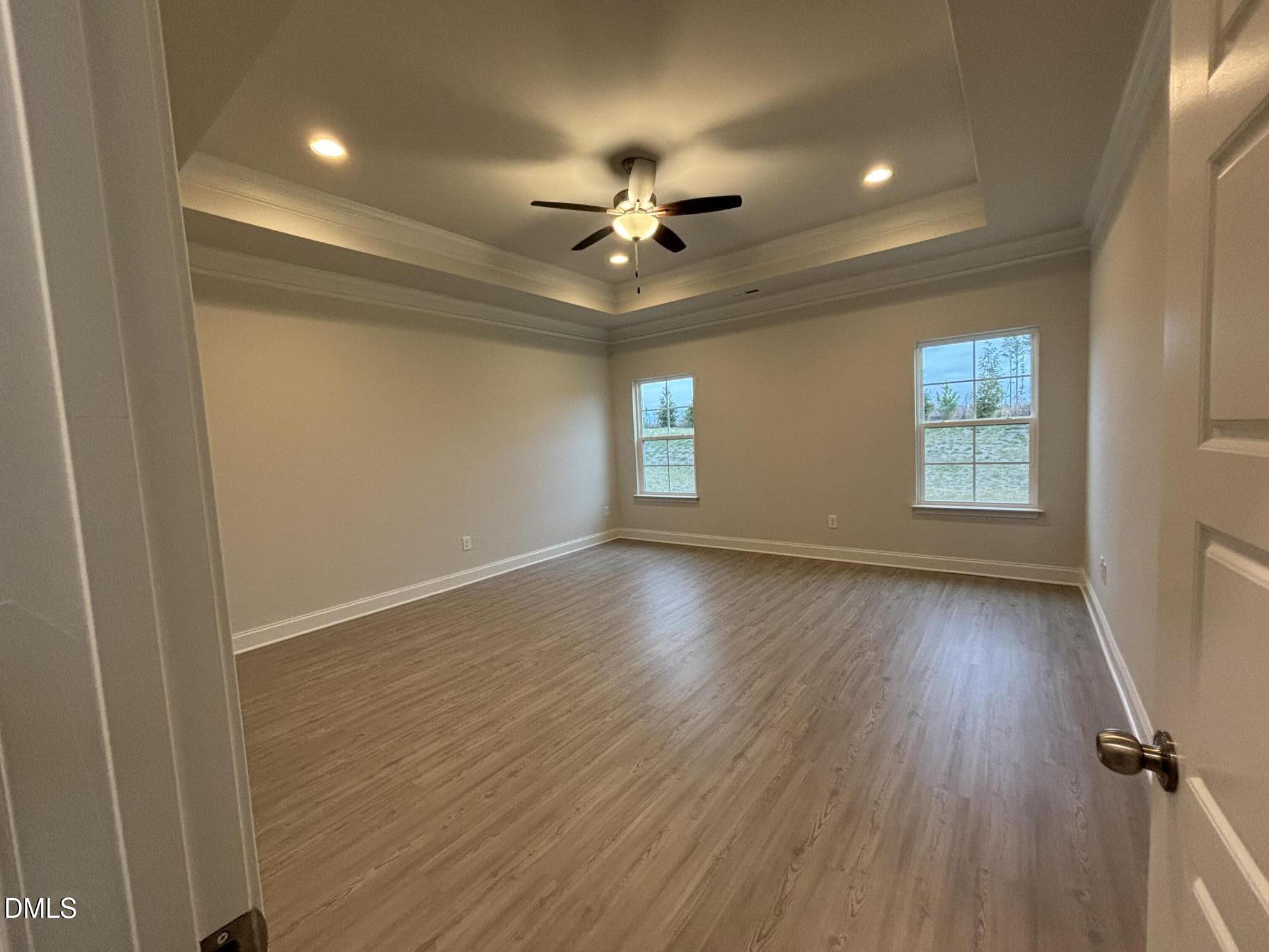 1911 Darrell Drive, Unit 4 Graham, NC 27253 - Photo 10 of 14 wooden floor in an empty room with a window