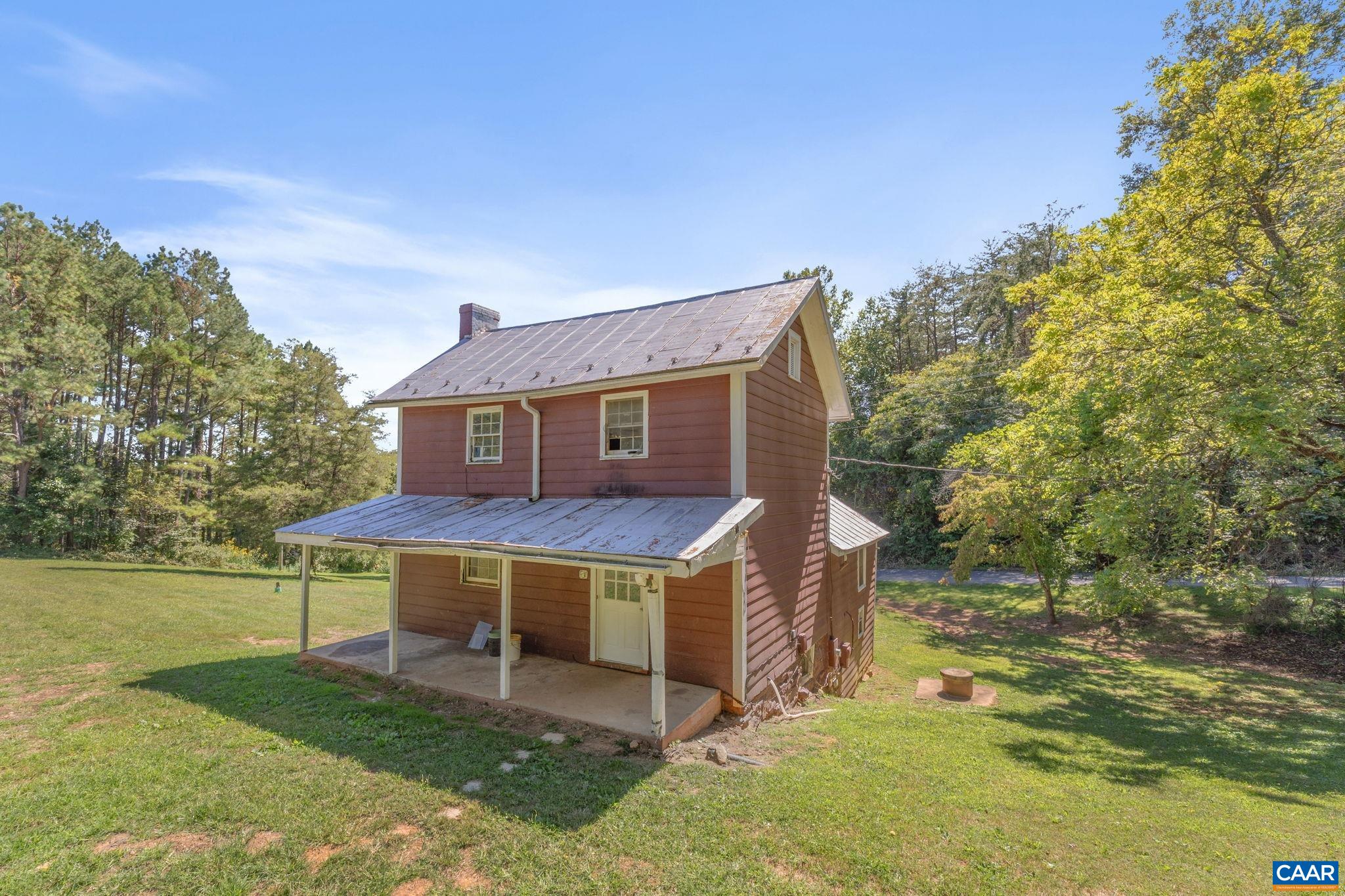 871 Chapman Road Stanardsville, VA 22973 - Photo 3 of 42 a view of a house with a yard balcony and furniture