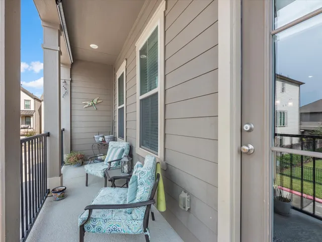 a living room with furniture and a gate