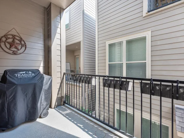 a view of a wooden door with a bench