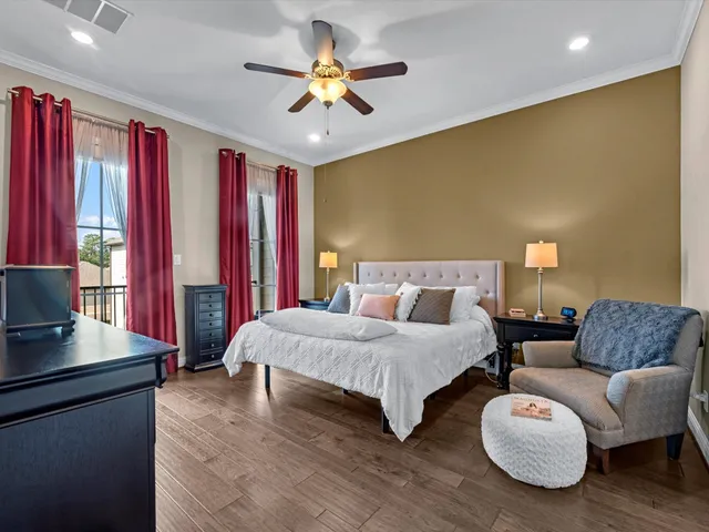 a spacious bedroom with a bed and a couch