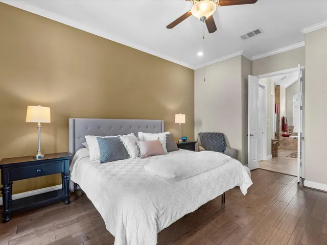 a bedroom with a bed and a lamp