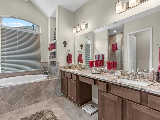 a bathroom with bathtub and shower