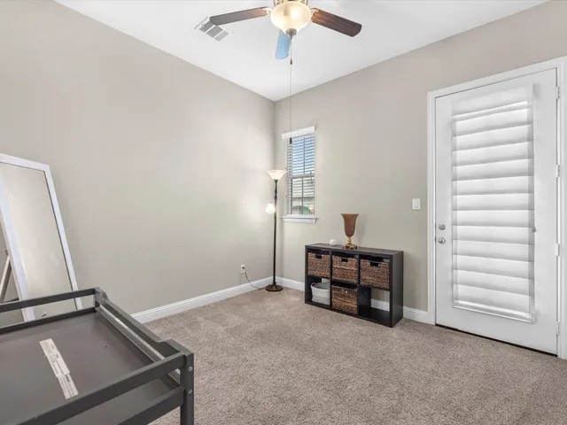 a view of a balcony with a small yard