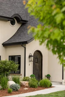 a front view of a house with garden