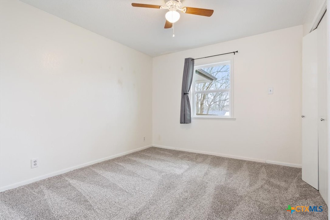 4005 Trailwood Drive Temple, TX 76502 - Photo 21 of 31 an empty room with windows and fan
