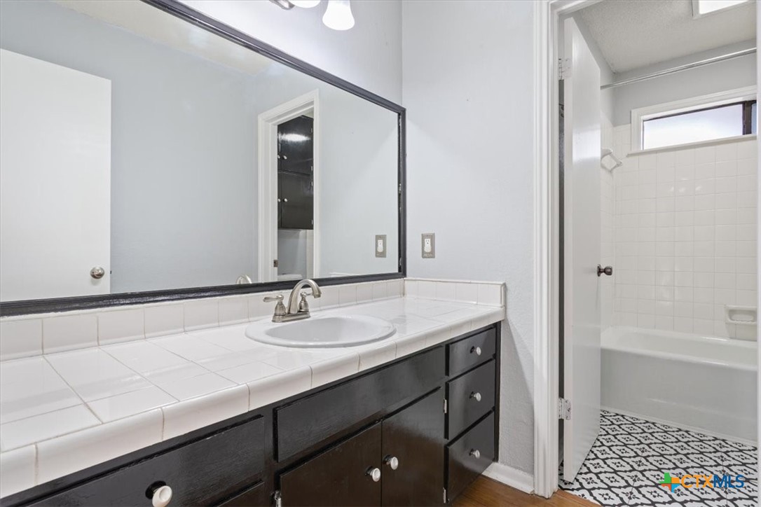 4005 Trailwood Drive Temple, TX 76502 - Photo 22 of 31 a bathroom with a sink and a mirror
