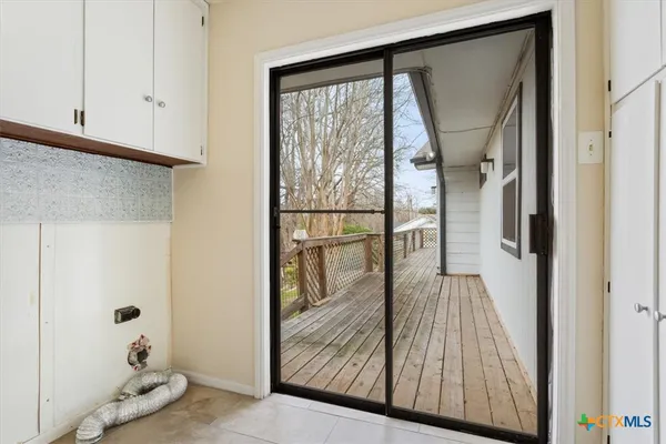 a view of balcony with wooden floor and fence