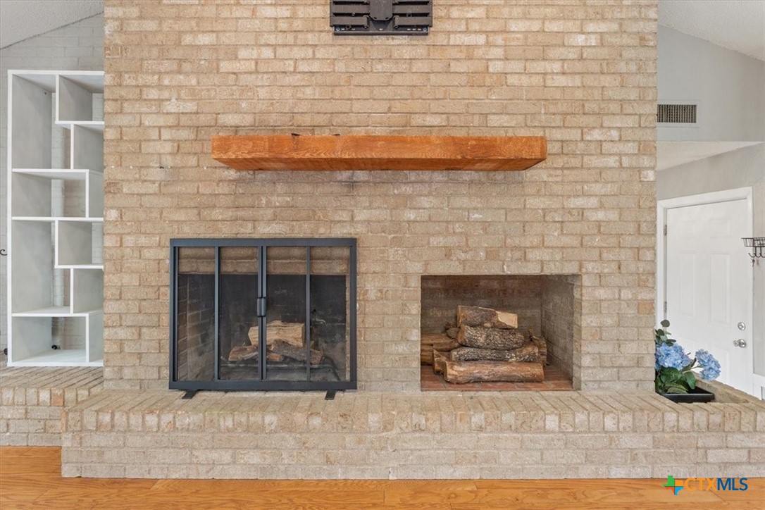4005 Trailwood Drive Temple, TX 76502 - Photo 5 of 31 a view of a fireplace with wooden floor