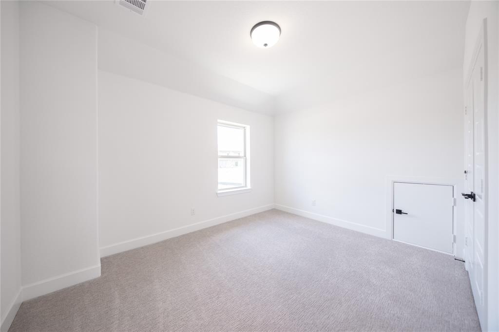 2719 Triumph Court Heath, TX 75126 - Photo 7 of 39 a view of an empty room with a window