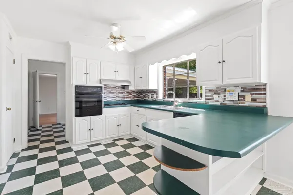 a kitchen with a cabinets and a stove