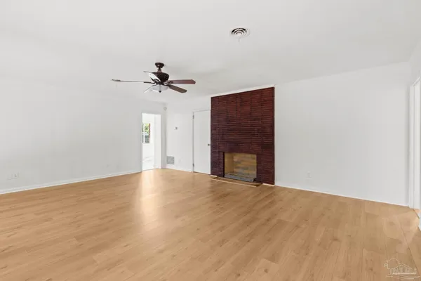 a view of an empty room with a window