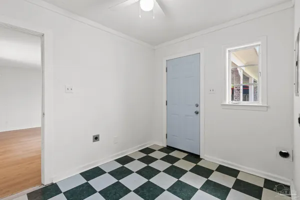 a white toilet sitting next to a white bath tub