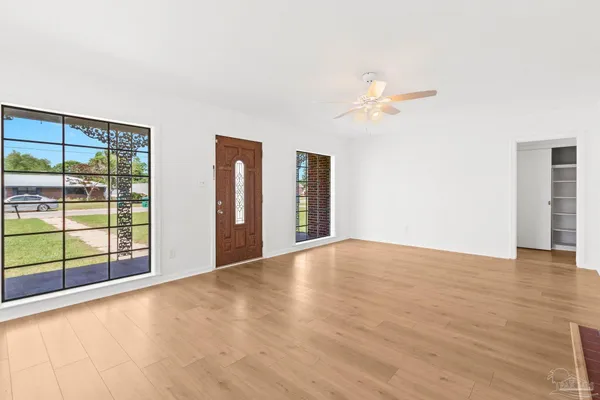 a view of an empty room with a window