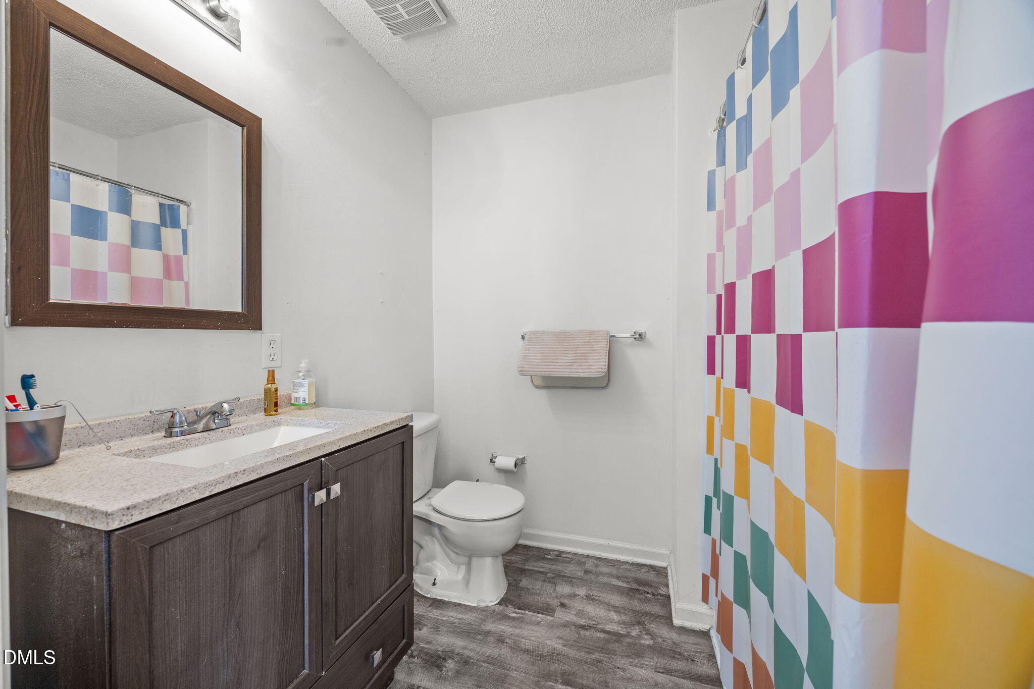 1305 Kent Road, Unit 101 Raleigh, NC 27606 - Photo 12 of 29 a bathroom with a sink and a mirror