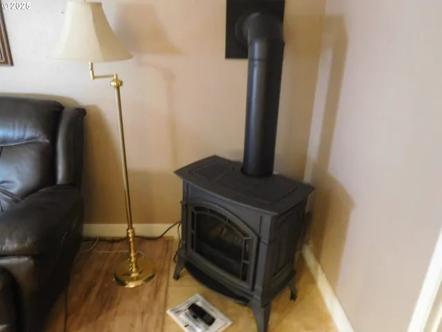 a stove top oven sitting inside of a kitchen