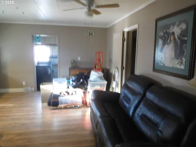 a dining room with furniture and a chandelier
