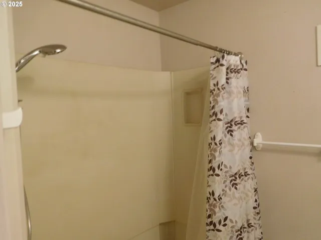 a bathroom with a shower curtain