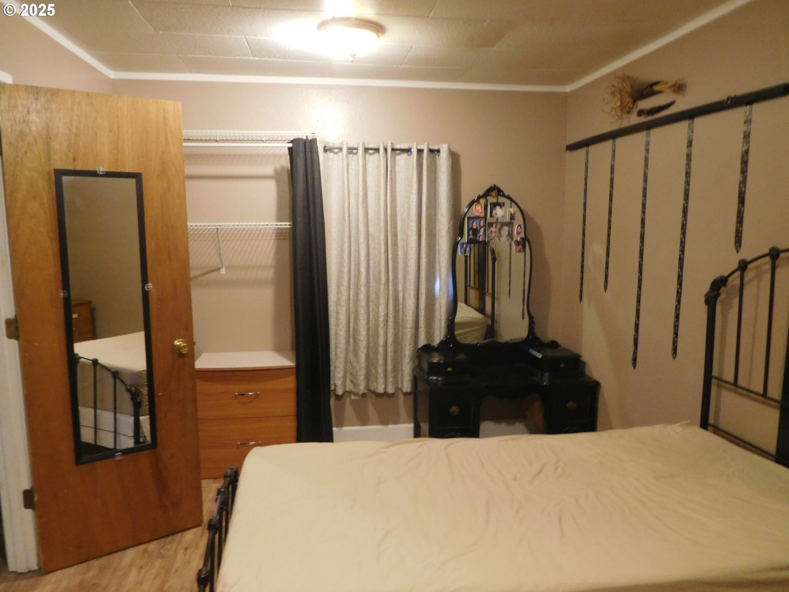 315 West Washington Street Athena, OR 97813 - Photo 19 of 25 a bedroom with a bed and a dresser