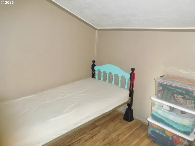 a bedroom with a bed and a table