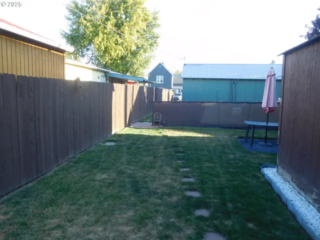 a view of a back yard of the house