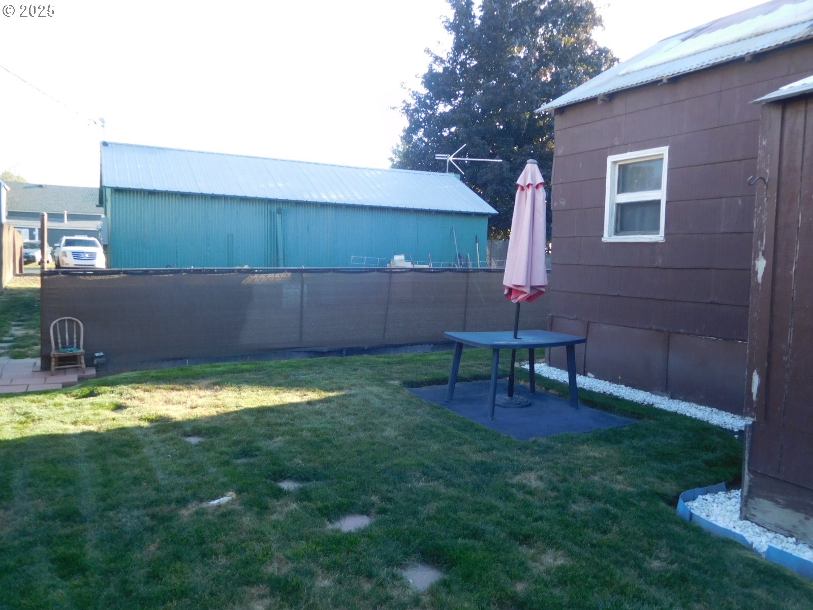 315 West Washington Street Athena, OR 97813 - Photo 24 of 25 a backyard of a house with table and chairs