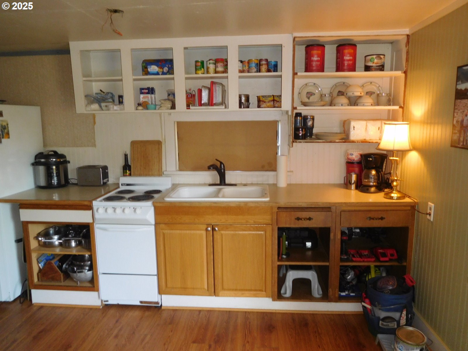 315 West Washington Street Athena, OR 97813 - Photo 6 of 25 a kitchen with stainless steel appliances granite countertop a stove and a refrigerator