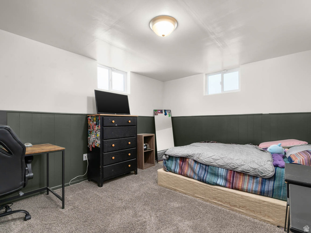 9902 South Poppy Lane Sandy, UT 84094 - Photo 15 of 25 Recessed windows, wall paneling, and carpeted flooring