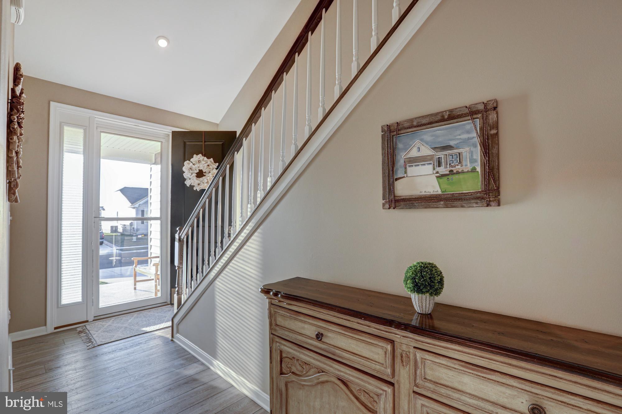 507 Cherry Bark Road Middletown, DE 19709 - Photo 16 of 81 a room with stairs and wooden floor