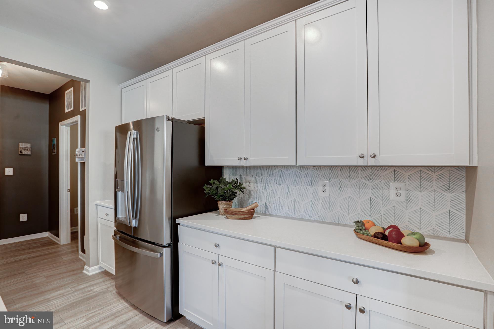 507 Cherry Bark Road Middletown, DE 19709 - Photo 19 of 81 a kitchen with stainless steel appliances a refrigerator sink and cabinets
