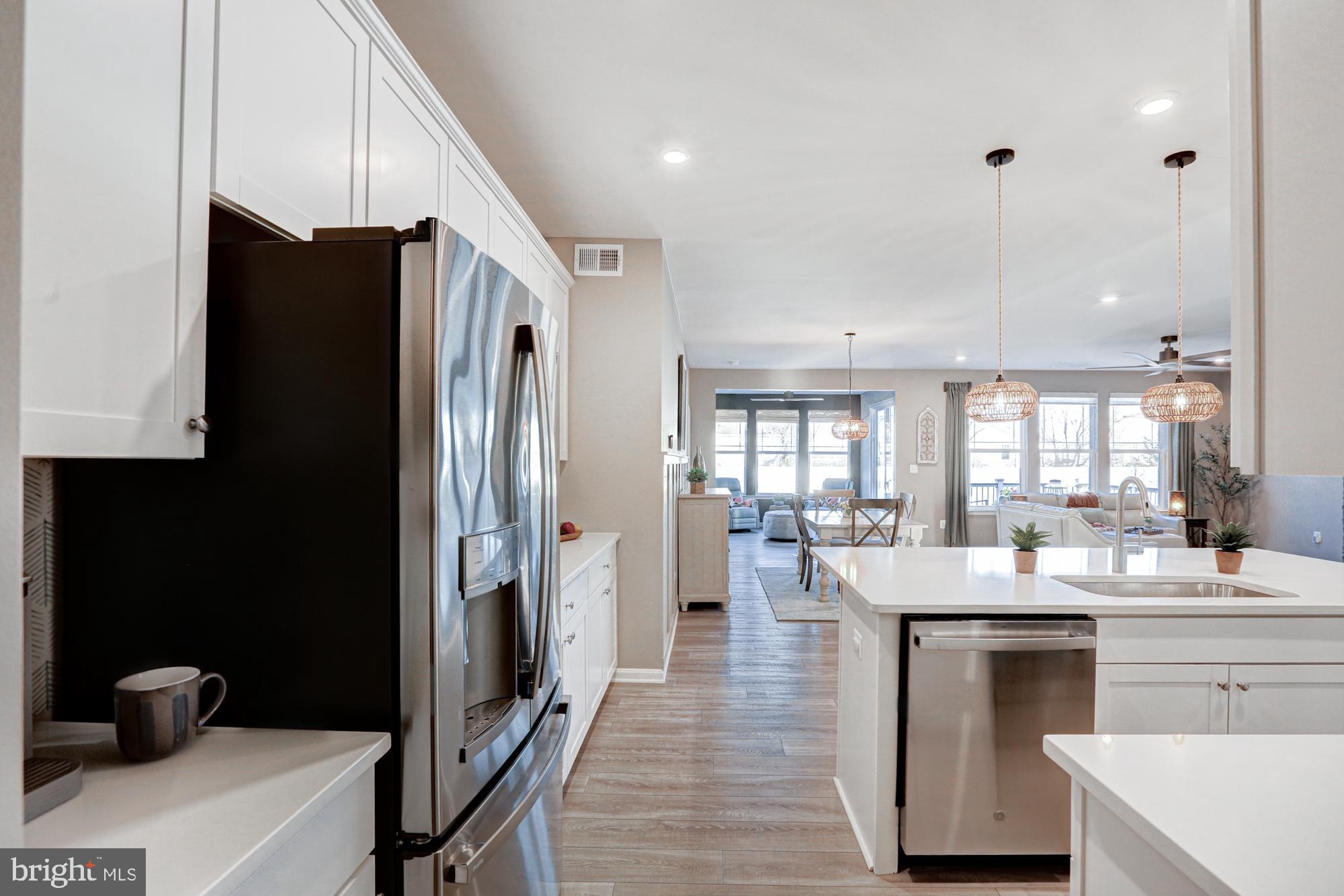507 Cherry Bark Road Middletown, DE 19709 - Photo 23 of 81 a kitchen with stainless steel appliances a refrigerator a sink a stove and white cabinets