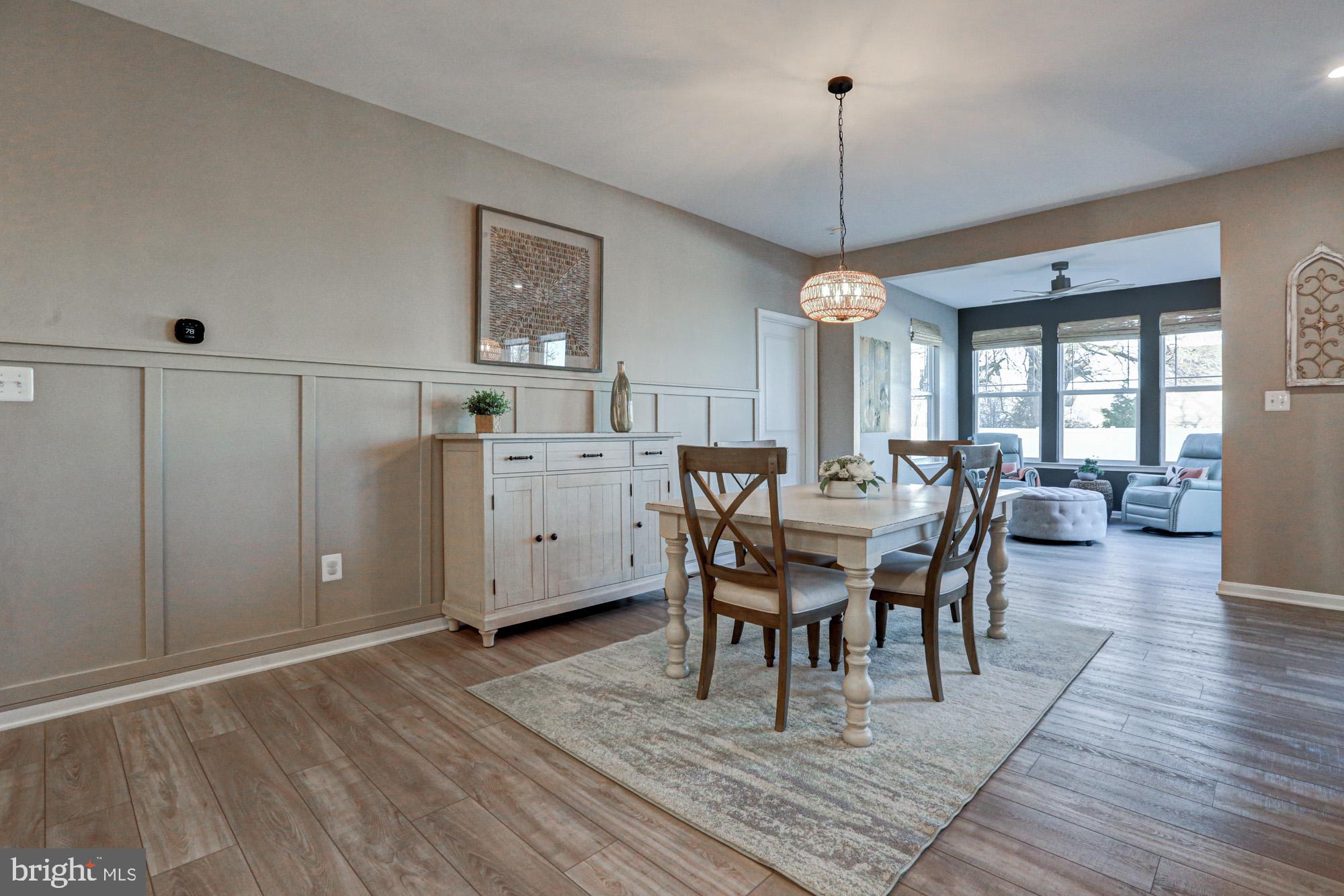 507 Cherry Bark Road Middletown, DE 19709 - Photo 28 of 81 a view of a dining room with furniture window and wooden floor