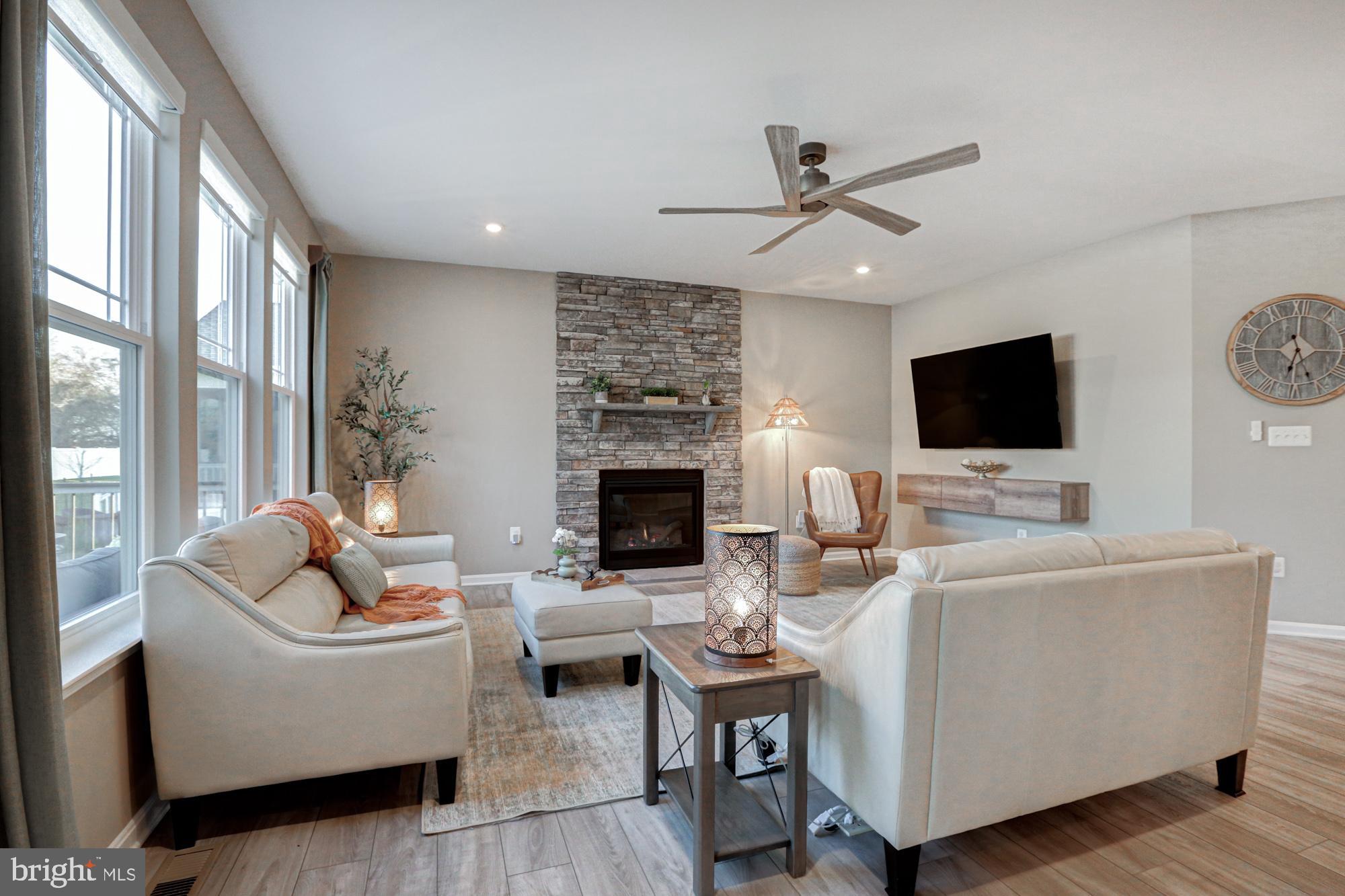 507 Cherry Bark Road Middletown, DE 19709 - Photo 30 of 81 a living room with furniture and a flat screen tv