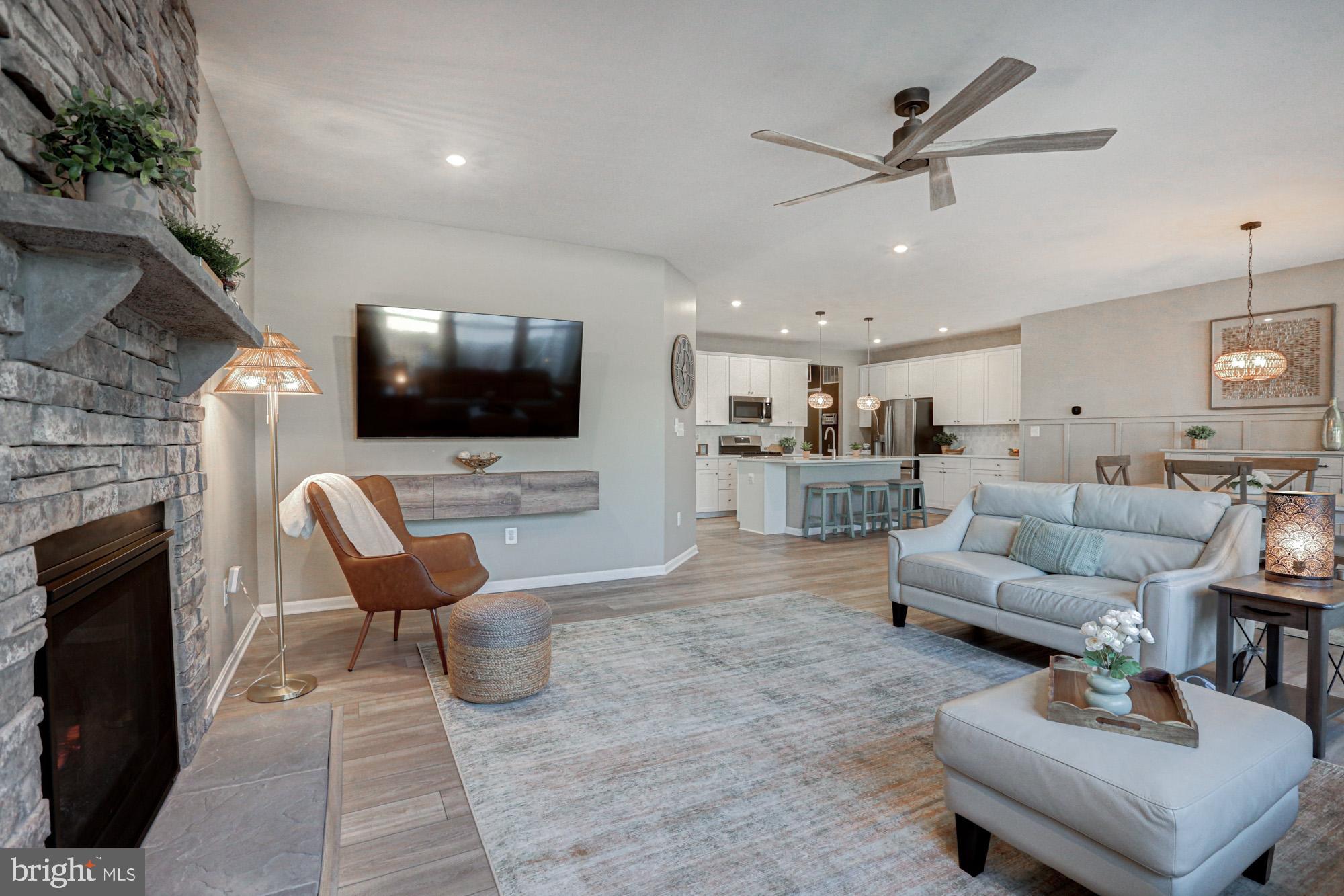 507 Cherry Bark Road Middletown, DE 19709 - Photo 32 of 81 a living room with furniture and a flat screen tv