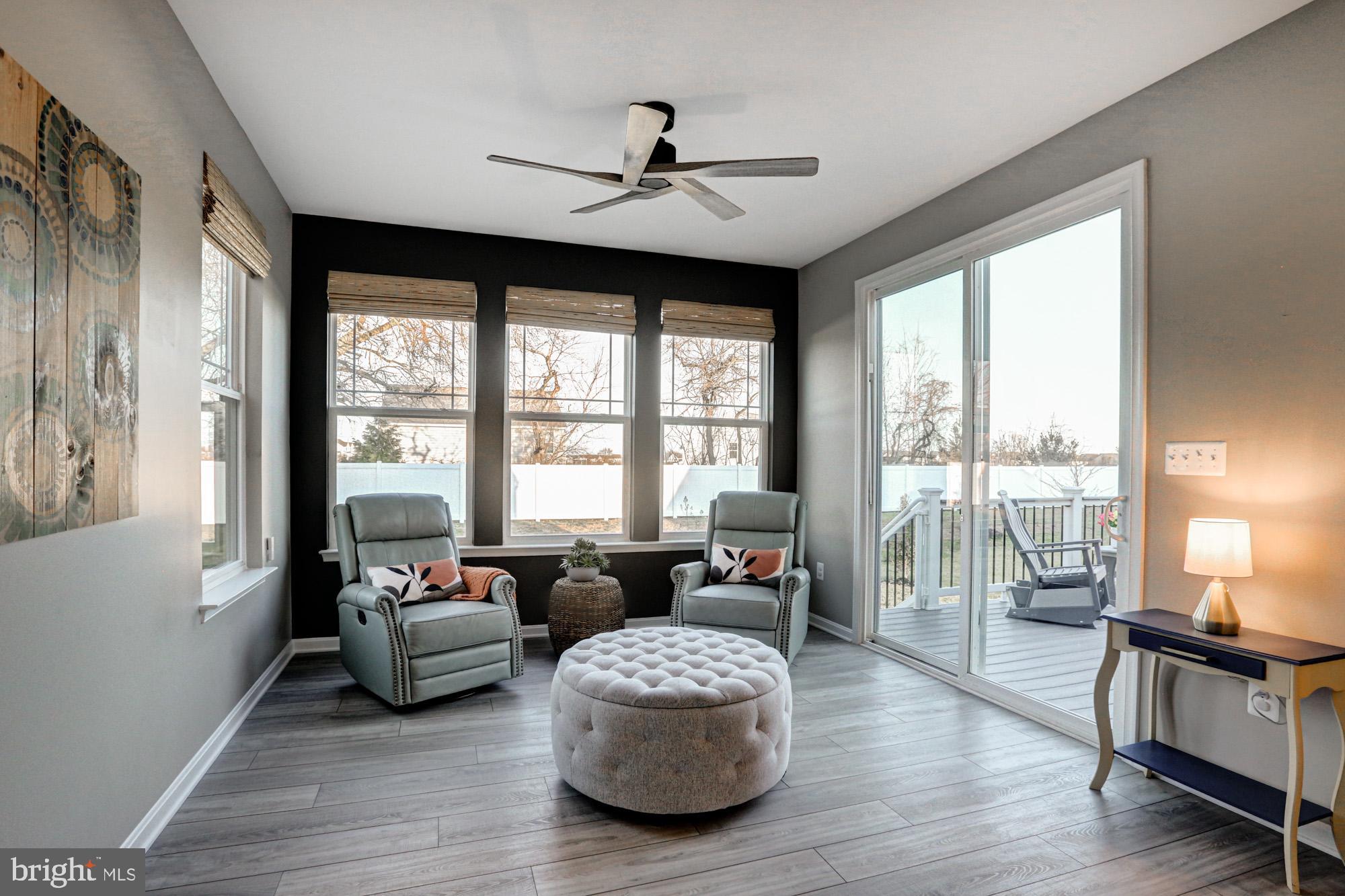 507 Cherry Bark Road Middletown, DE 19709 - Photo 35 of 81 a living room with furniture and floor to ceiling windows
