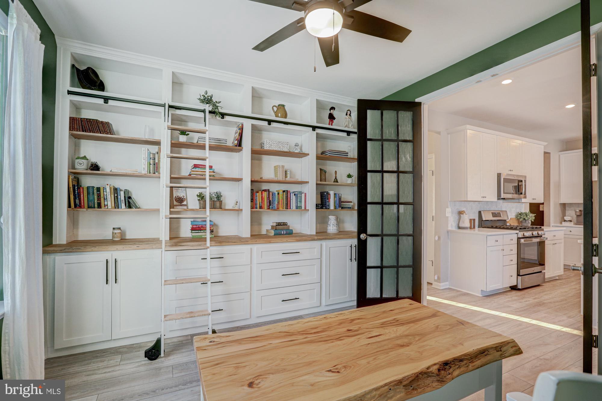 507 Cherry Bark Road Middletown, DE 19709 - Photo 39 of 81 a room with a bed cabinets and a window