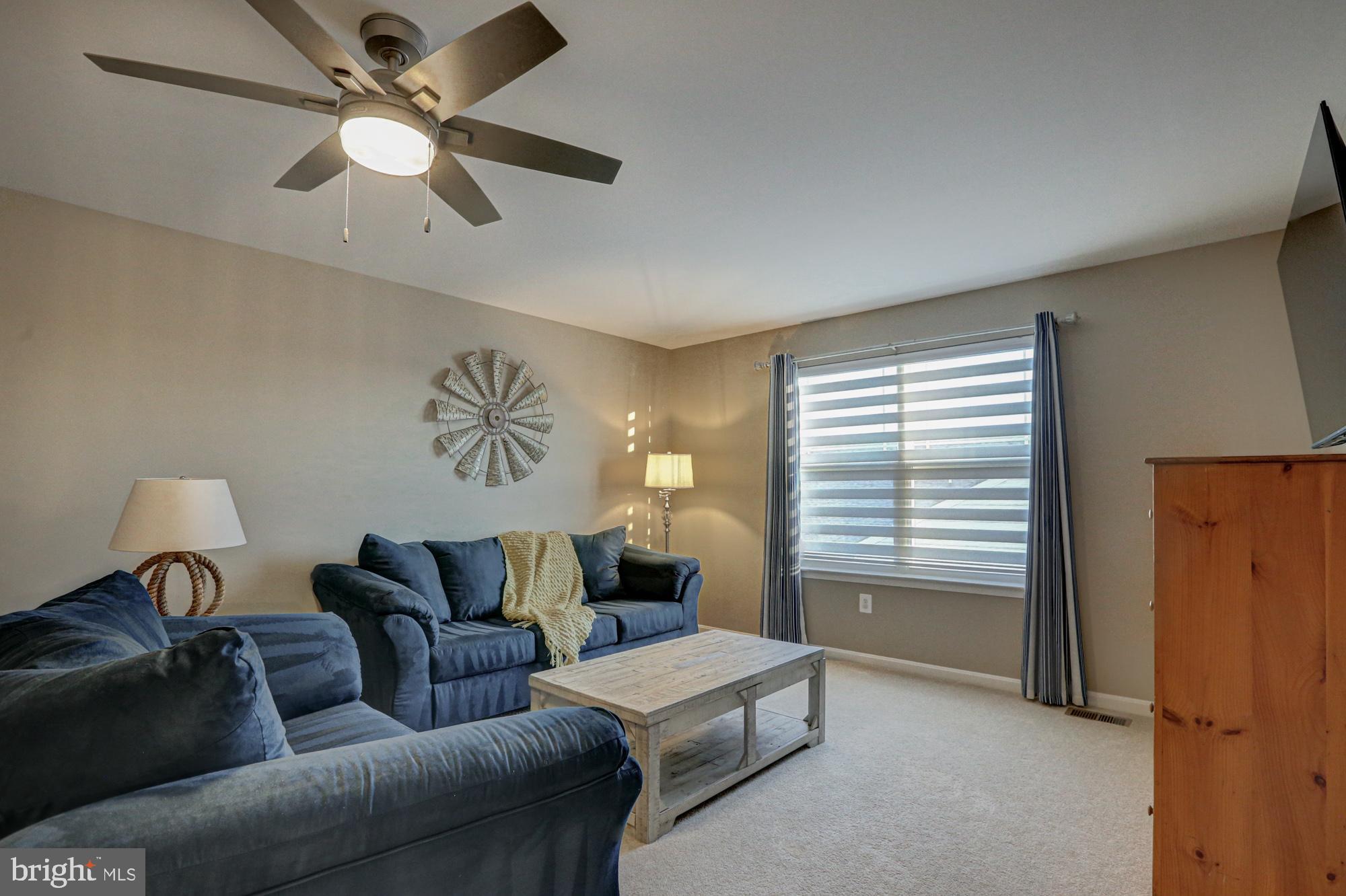 507 Cherry Bark Road Middletown, DE 19709 - Photo 58 of 81 a living room with furniture and a window