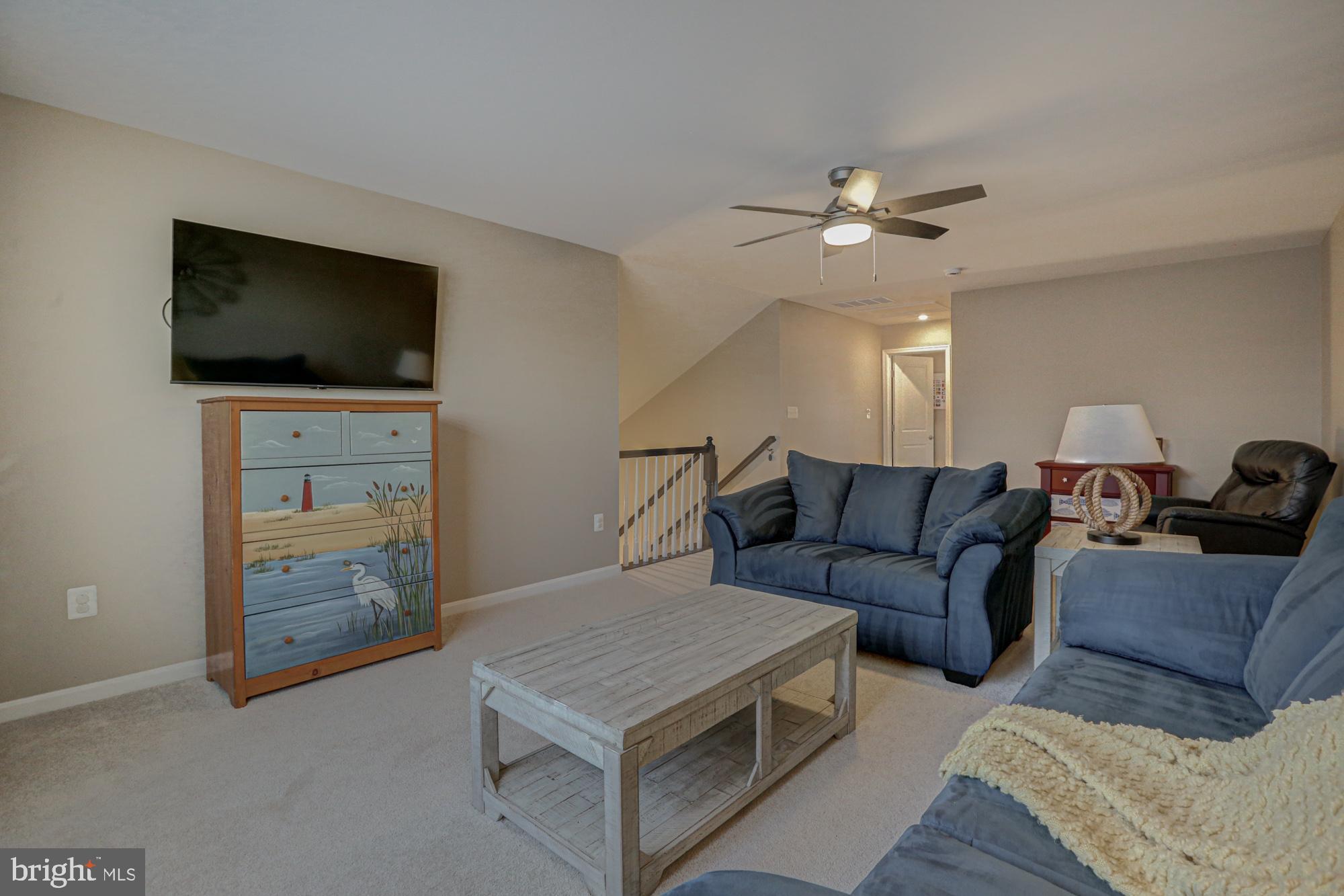 507 Cherry Bark Road Middletown, DE 19709 - Photo 61 of 81 a living room with furniture and a flat screen tv